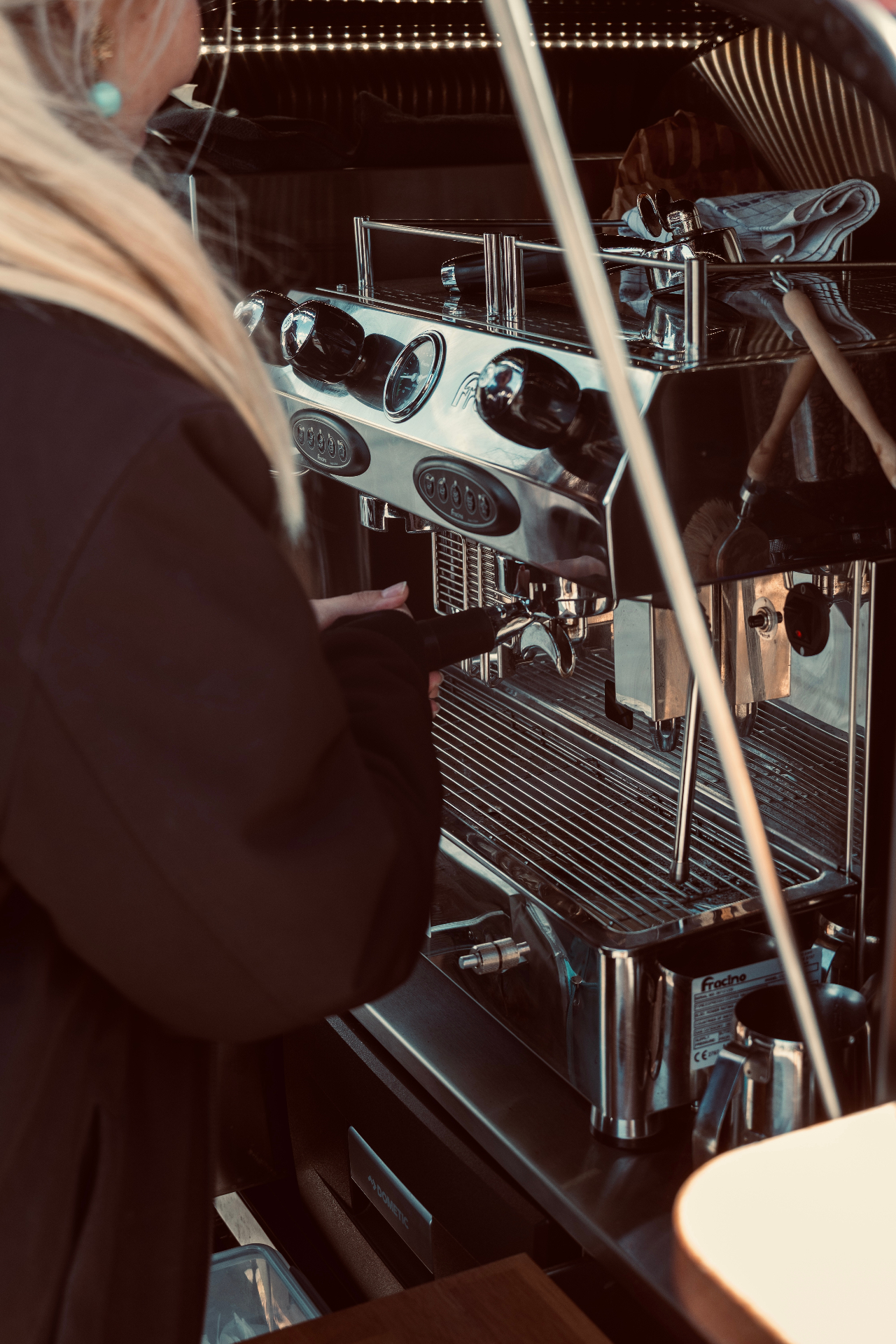 Barista working the espresso machine in the van