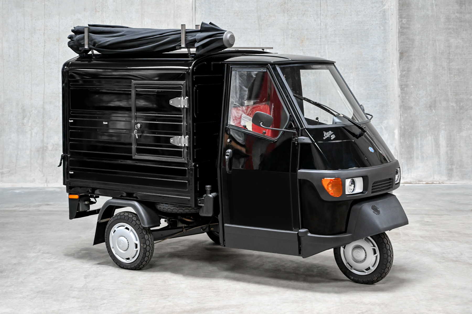 The black Ape coffee van closed, ready to travel